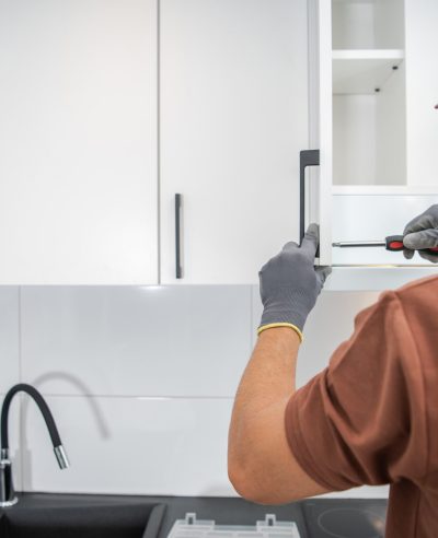 cabinetmaker-finishing-residential-kitchen-cabinet-2025-03-13-12-25-17-utc