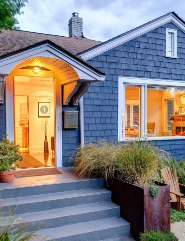 illuminated-front-stoop-and-of-blue-house-2025-04-03-23-28-33-utc (1)